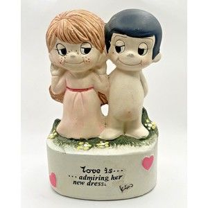 Vintage Bank 1974 Love is Kim Casali admiring her new dress!